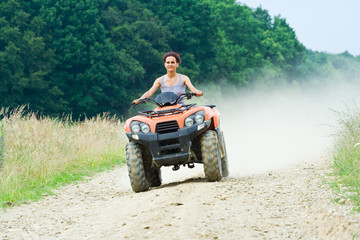 Woman riding ATV