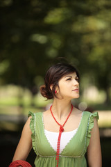 young lady looking at the nature with a peaceful face