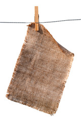 burlap canvas with lacerate edges hanging with wooden peg - 8281552