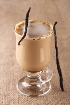 Coffee Vanilla Latte With Bean In Tall Glass On Hessian Backgrou