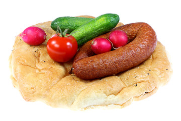 Bread, sausage and vegetables.