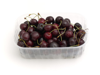 sweet cherries in a plastic basket