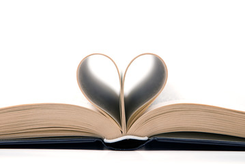 romantic book with pages curved into a heart shape