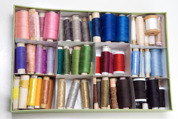 box full of colorful thread.