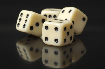 white dice on a black background