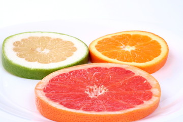 Naklejka na ściany i meble Three slice fresh citrus isolated on white