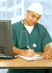 Nurse Writing On Clip Board