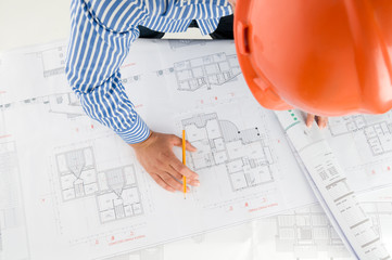 Architect working with technical drawings