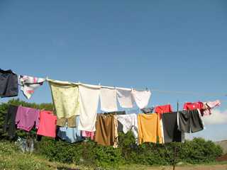 Different color clothes, drying on the rope