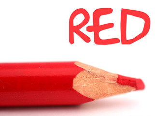 closeup of red pencil crayon with the word red above it