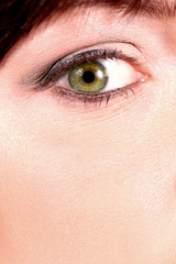 green eye close-up of a young model great skin pores