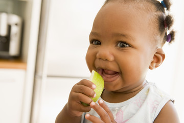 Young girl eating apple