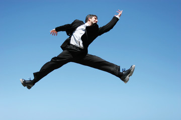 Businessman jumping for success