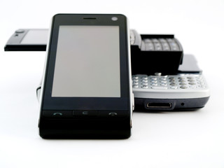 Stack Pile of Several Modern Mobile Phones PDA Cell Handheld Uni