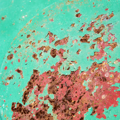 Green and red rusted metal.