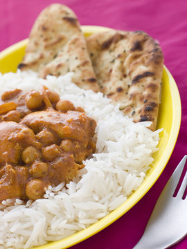 Chicken And Chickpea Curry With Rice And Naan Bread