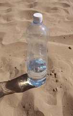 bottle on sand