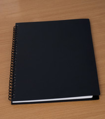 spiral notebook on a table