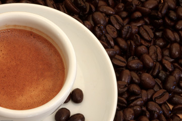 Cup of Espresso w/beans closes-up top view