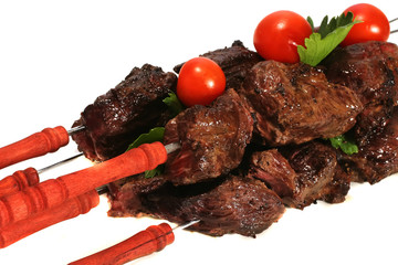hot grilled meat on skewer over white