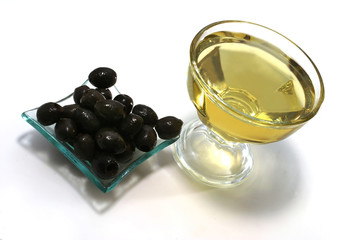 gold olive oil with black olives