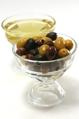 olive oil with green, black and brown olives