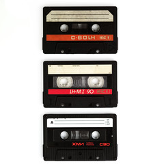 three old cassettes isolated on white