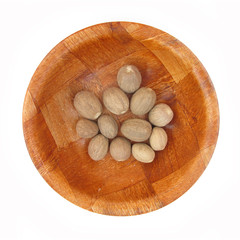 Nutmegs in wooden dish