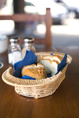 basket with white bread on table at beach bar