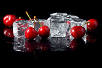 Fresh cherries with ice cubes