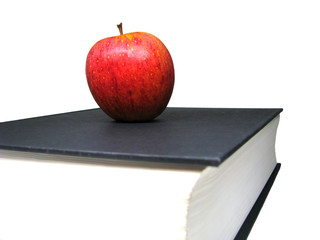 Close-up Red Apple Above Black Book
