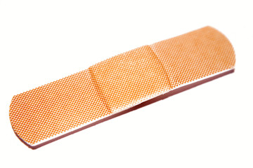 Single adhesive bandage on white background