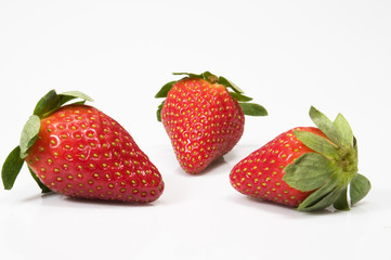 three juicy red strawberries