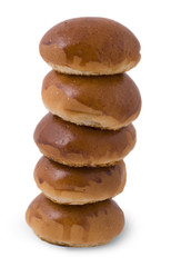 Balanced buns isolated on white background.