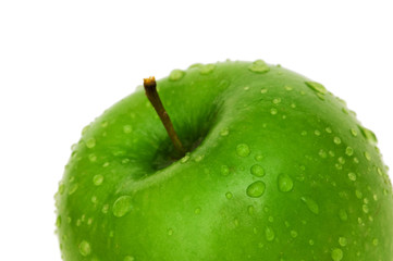 Green apple with dew isolated on white