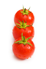 Row of tomatoes isolated on the white