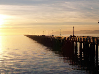 Fototapeta na wymiar Long Fishing Pier stretching out into bay