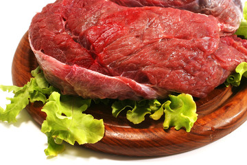beef meat and salad over white on plate