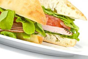 Focaccia  Sandwich with Ham on a White Plate
