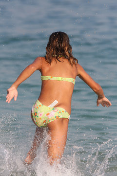 Little girl enjoying the Ionian sea