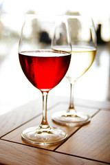 Glass of red and white wine on a table