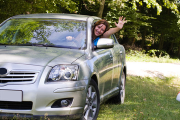 Happy woman in car