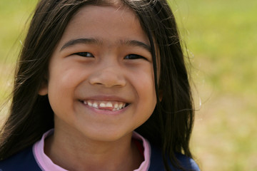 Fototapeta premium Smiling asian girl with toothy smile