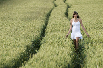 Beautiful teenager running in cereal.