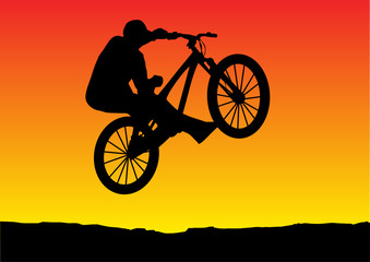 Fototapeta premium sunset biker jumping