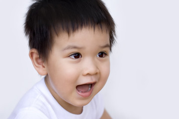 Little boy, surprised, looking away from camera