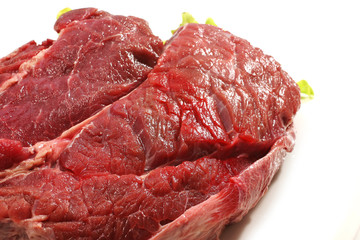 beef meat and salad over white