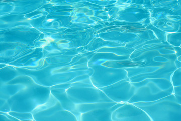 Fototapeta na wymiar Clear blue swimming pool water