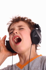 Boy listening to music and singing