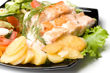 Stake from a salmon with vegetables